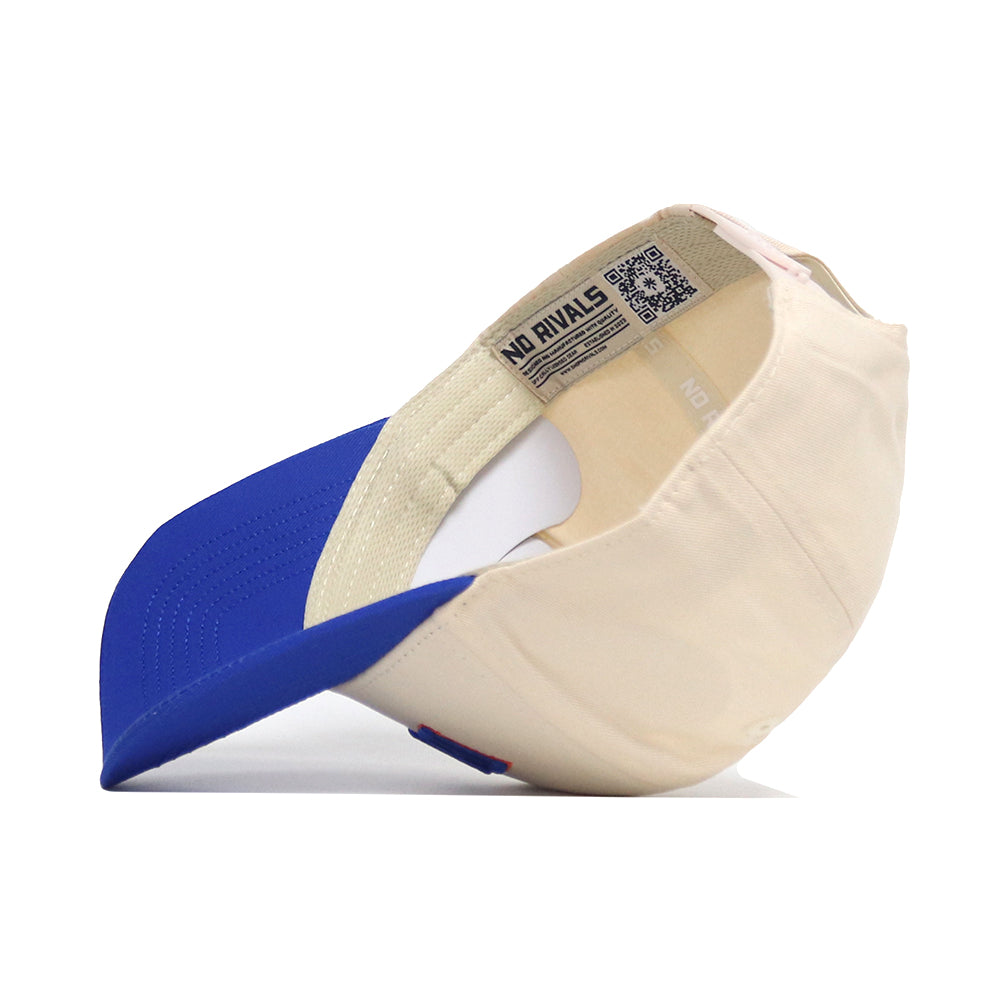 The No Rivals Boise Hometown Hat, a cream and blue snapback, is pictured inside-out on a white background, highlighting its interior tags, structured fit, and detailed stitching.