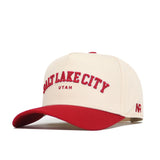 The No Rivals Salt Lake City Hometown Hat is a cream cotton cap with a red brim. “Salt Lake City Utah” and “AR” are embroidered in red for style and pride. Enjoy its comfortable, structured fit.