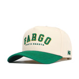 The Fargo Hometown Hat by No Rivals is a beige snapback made from high-quality cotton, with "FARGO NORTH DAKOTA" embroidered in green and yellow, a green brim, and NR initials stitched on the side for structure.