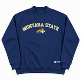 Navy Montana State Mock Neck sweatshirt in heavyweight cotton with MONTANA STATE and a bobcat mascot logo in yellow and white across the chest.