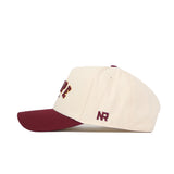 The Tempe Hometown Hat by No Rivals is a cream structured fit hat with a maroon brim and top button, maroon and yellow embroidered text including "NR" on the side, high-quality cotton, and snapback sizing.