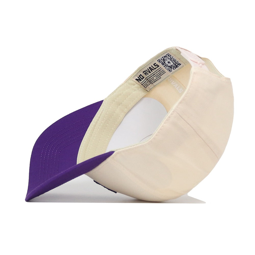 The TCU Aer Lingus Hat by No Rivals is displayed upside down, highlighting a NO RIVALS label and QR code inside the crown. Featuring a beige design with a purple brim, this snapback hat is the perfect finishing touch to your gameday outfit.