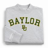 No Rivals Baylor Mock Neck oversized grey sweatshirt featuring the word BAYLOR and a BU logo in green with gold outlining, with a small brand logo on the sleeve cuff.
