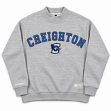 Oversized gray Creighton Mock Neck sweatshirt featuring CREIGHTON in blue varsity lettering above a blue jay mascot logo on the chest.