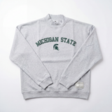 The No Rivals Michigan State Mock Neck sweatshirt features an oversized fit, light gray color, and green "MICHIGAN STATE" with Spartan helmet logo across the chest, displayed on a white background.