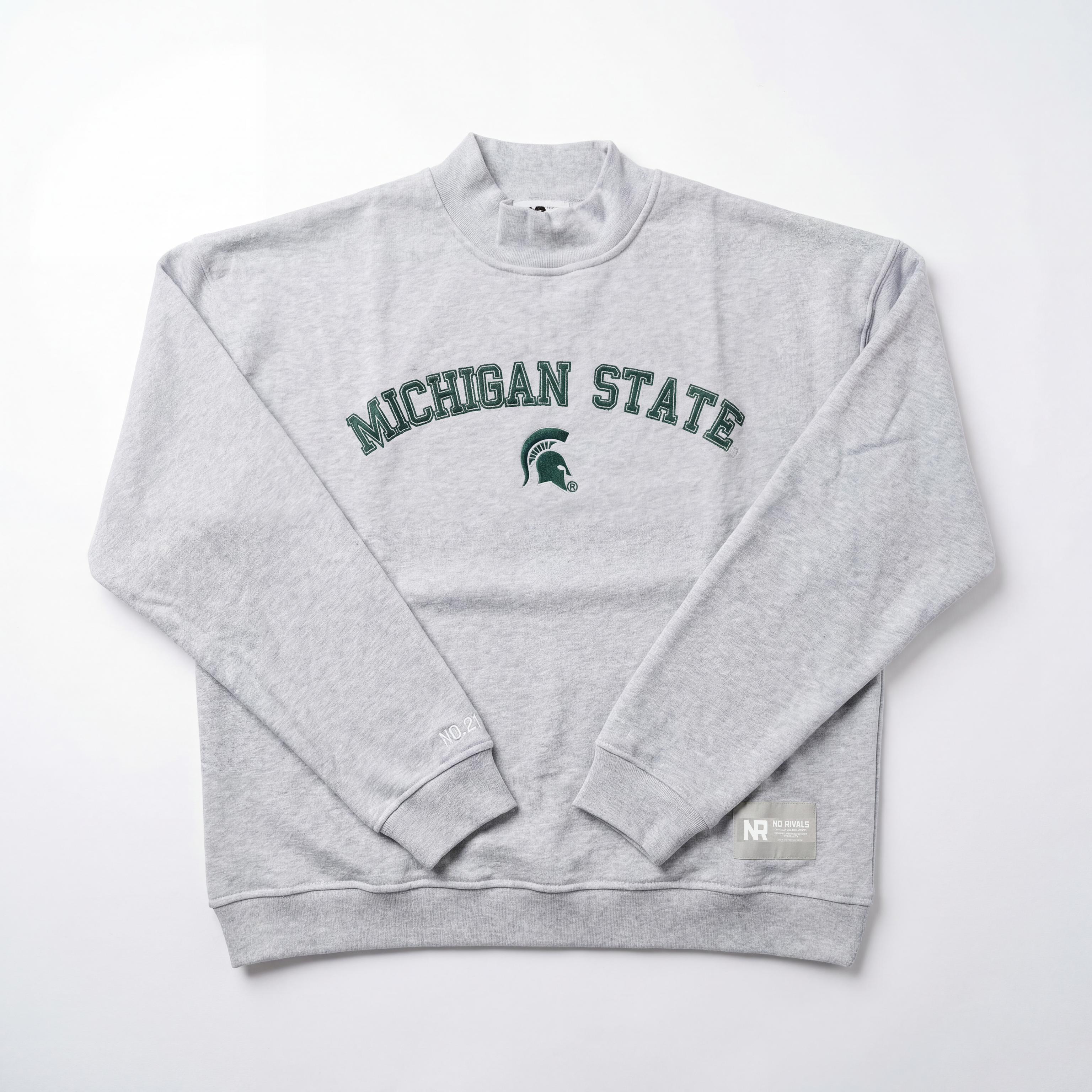 The No Rivals Michigan State Mock Neck sweatshirt features an oversized fit, light gray color, and green "MICHIGAN STATE" with Spartan helmet logo across the chest, displayed on a white background.