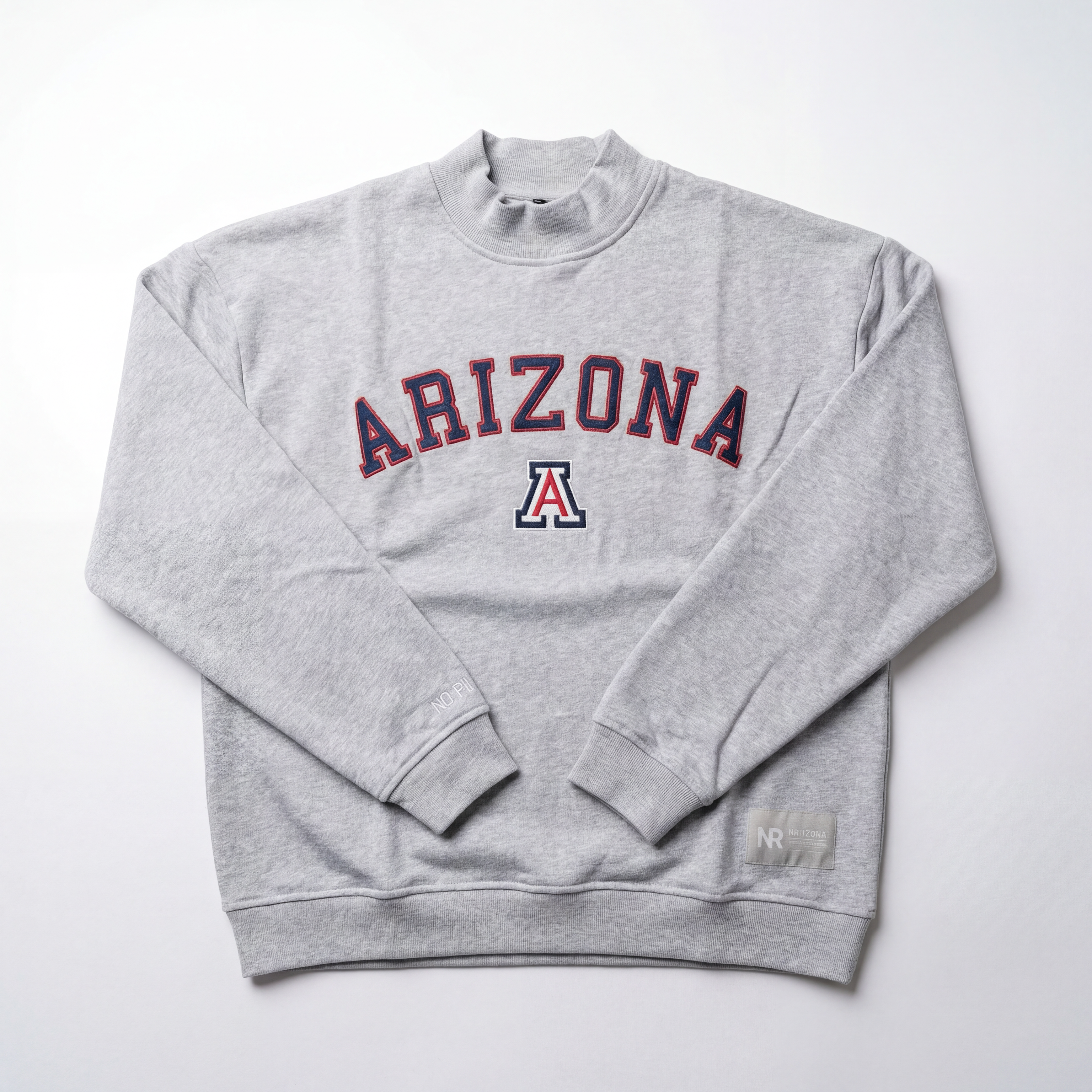 The No Rivals Arizona Mock Neck is a light gray heavyweight cotton crewneck, featuring "ARIZONA" in bold red and blue letters with a matching A logo centered below on the chest, shown laid flat on a white background.