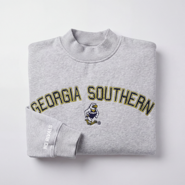 A folded gray Georgia Southern Mock Neck by No Rivals with GEORGIA SOUTHERN and a cartoon eagle on the front; NO RIVALS printed in white on the sleeve. Plain light background.