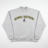 The No Rivals Georgia Southern Mock Neck is a light gray, oversized sweatshirt with bold yellow "GEORGIA SOUTHERN" lettering and a small mascot graphic across the chest, shown laid flat on a white background.