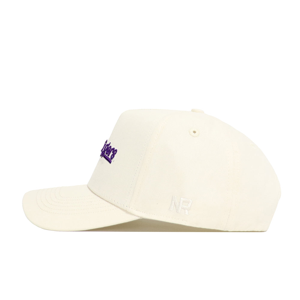 The No Rivals LSU Sideline Hat is a cream snapback made from high-quality cotton, featuring purple embroidered text on the front and white NR initials on the side, displayed from a side angle against a white background.
