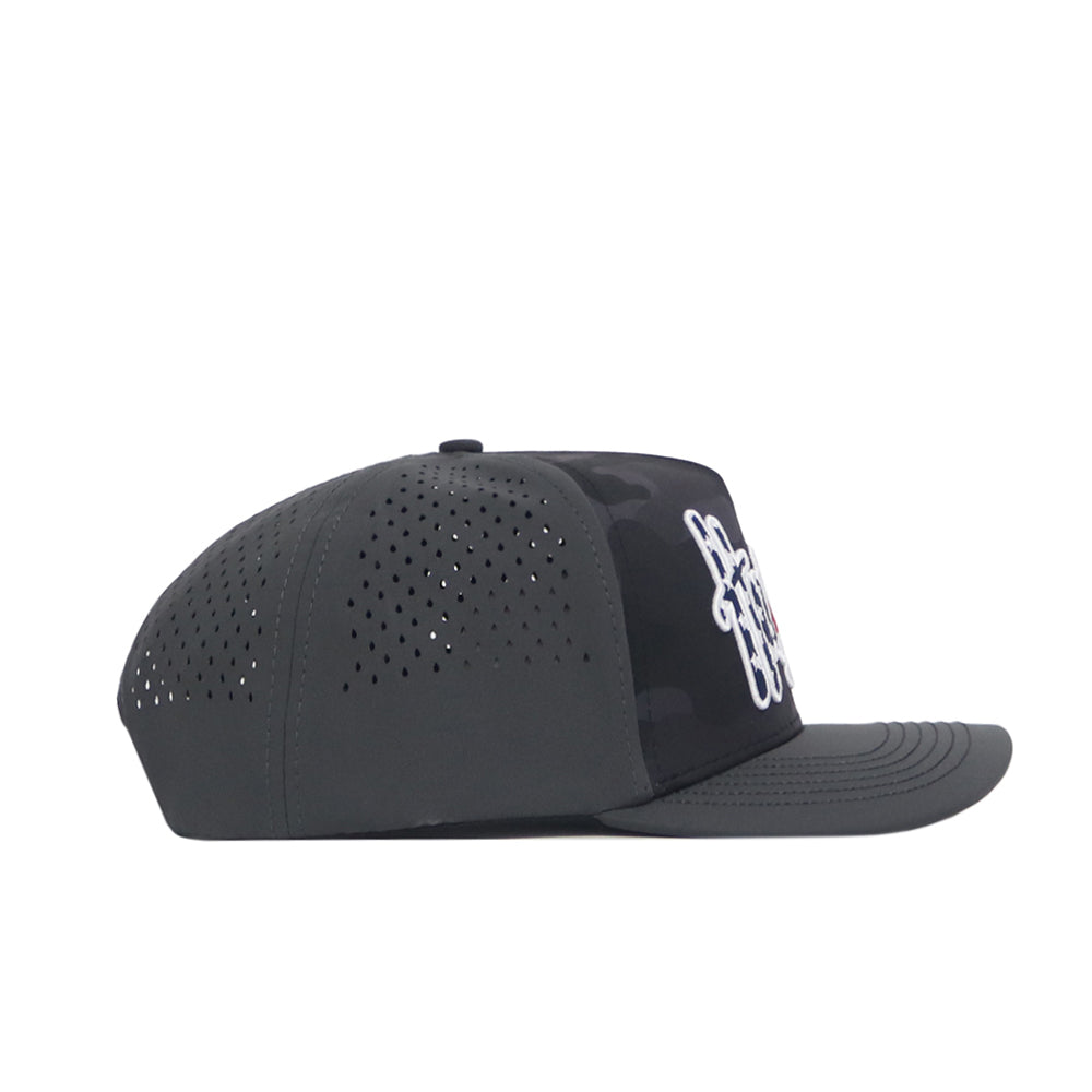 Side view of the No Rivals Nebraska Cornhuskers Military Appreciation Hat in dark gray, featuring perforated panels for ventilation, an embroidered front logo, a flat brim, structured fit, and a modern look.