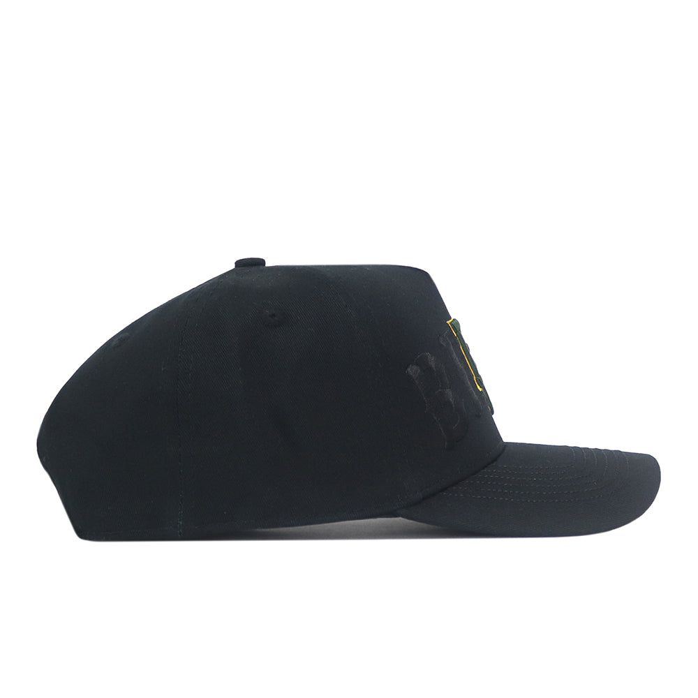 Side view of a black Baylor Bears Night Mode Hat with BAYLOR embroidered in black, gold, and green on the front.