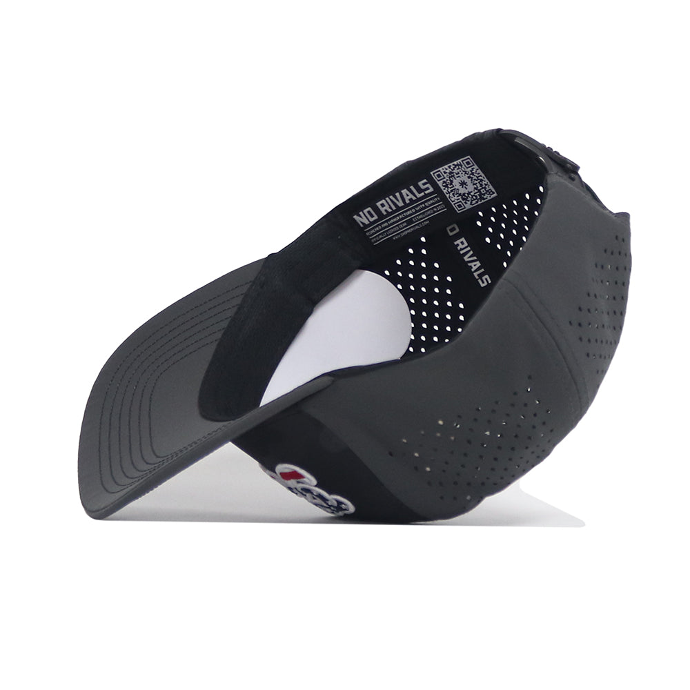 The Georgia Bulldogs Military Appreciation Hat by No Rivals is shown upside down, revealing the inside label with NO RIVALS, a QR code, and embroidered logo. This black cap has ventilation holes and a snapback closure for an adjustable fit.