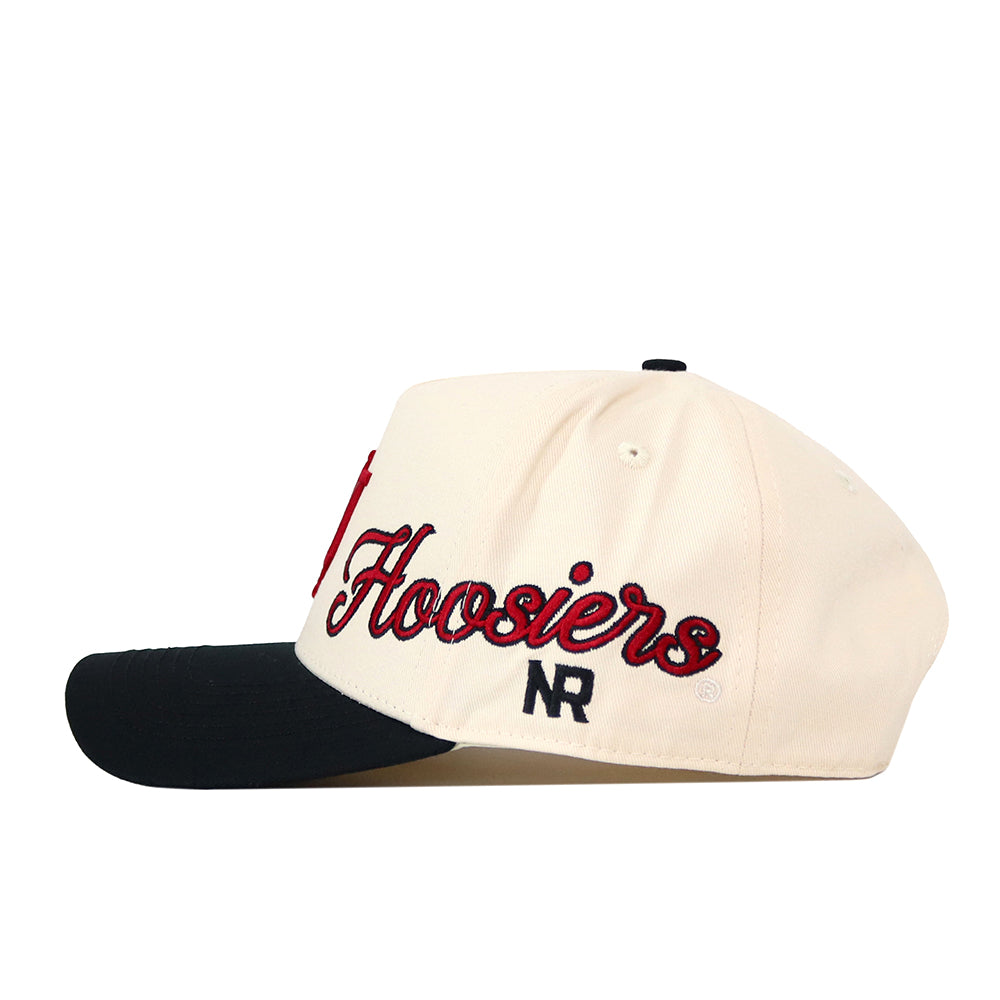 Show your team spirit with the Indiana Hoosiers Halftime Hat by No Rivals. This cream baseball cap features a striking black brim, “Hoosiers” embroidered in bold red and black script on the side, and “NR” stitched below. Finished with an embroidered logo and adjustable snapback closure, it’s the perfect addition to your gameday outfit.