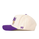 A cream and purple snap back hat featuring the LSU Tigers name and logo on the front, crafted from high-quality cotton for lasting comfort, with the initials NR embroidered on the side in a structured fit by No Rivals.