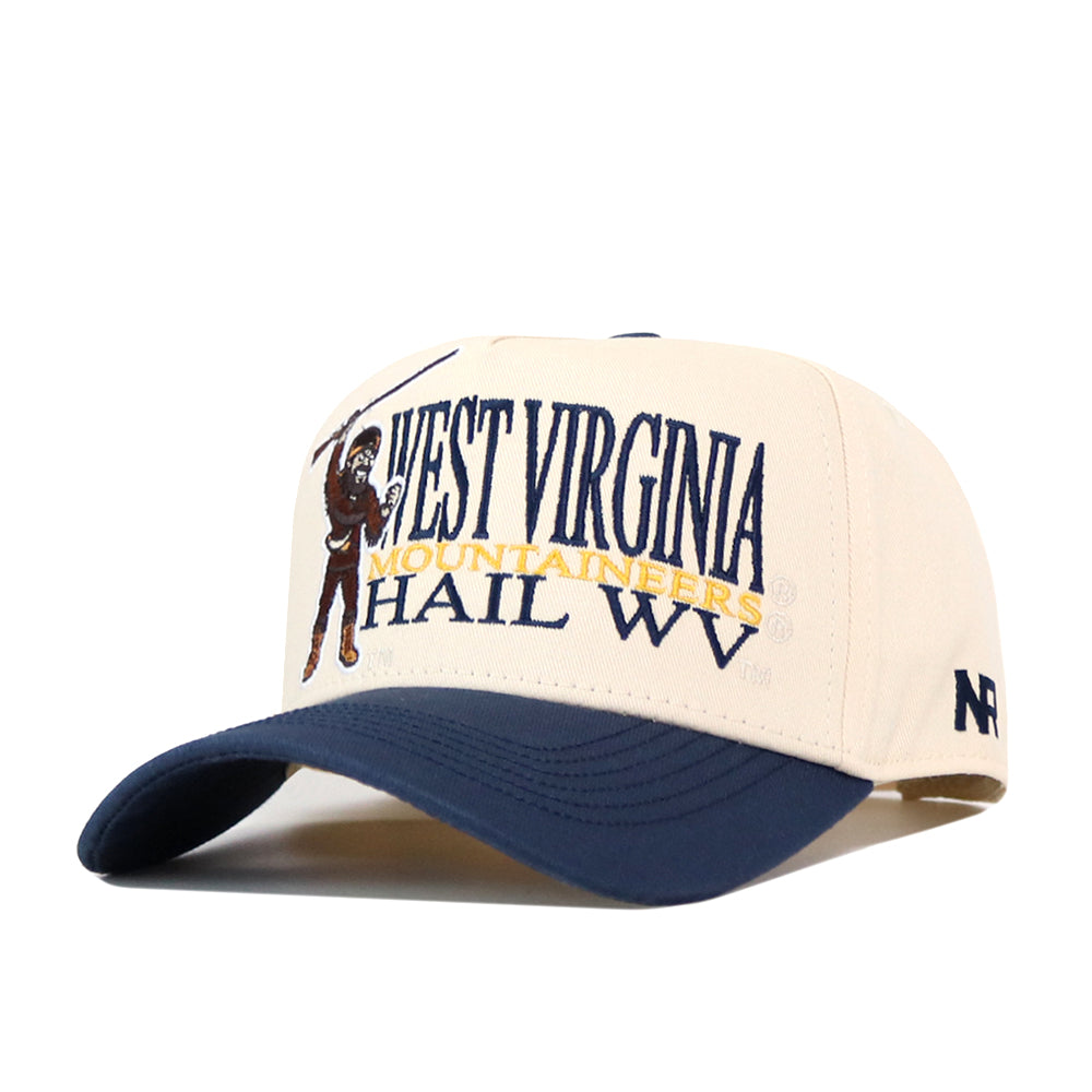 The No Rivals WVU Mountaineers Stacked Mascot Hat features a beige and navy blue design with “West Virginia Mountaineers Hail WV” and a mountaineer embroidered logo on the front. The navy blue bill and adjustable snapback closure ensure a comfortable fit.
