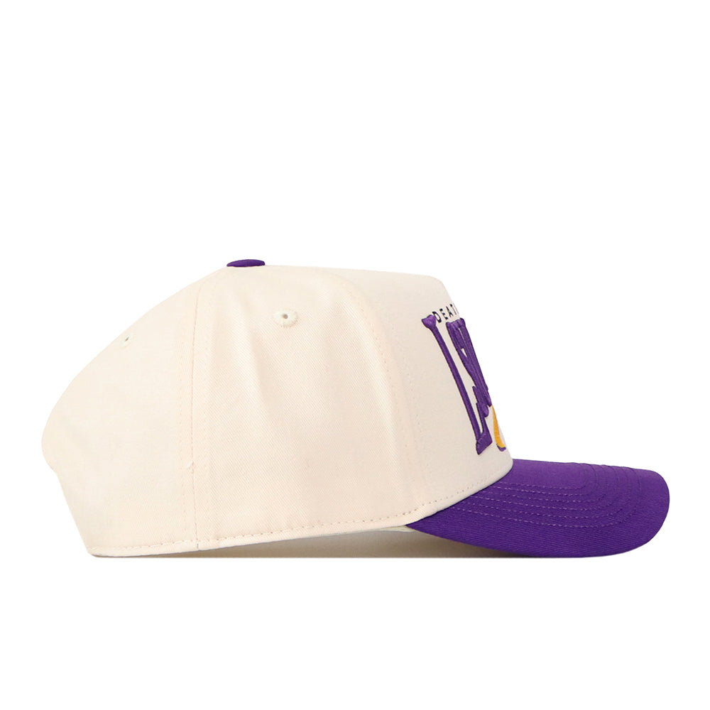 The LSU Tigers Stride Hat by No Rivals is a cream-colored baseball cap with a purple brim, shown from the side. Made from high-quality cotton with a structured fit, it features partially visible purple lettering on the front.