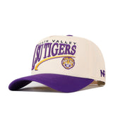 Introducing the LSU Tigers Stride Hat by No Rivals—a beige and purple snapback baseball cap featuring “Death Valley LSU Tigers” and a tiger head embroidered on the front. Made from high quality cotton for a structured fit, this hat includes a purple brim and an N logo on the side.
