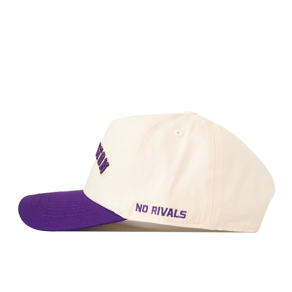 The Right Side Up Washington Hat - UW - Classic by No Rivals features a cream-colored crown with a purple brim, “NO RIVALS” embroidered in purple on the side, and an adjustable snap back for a comfortable fit.