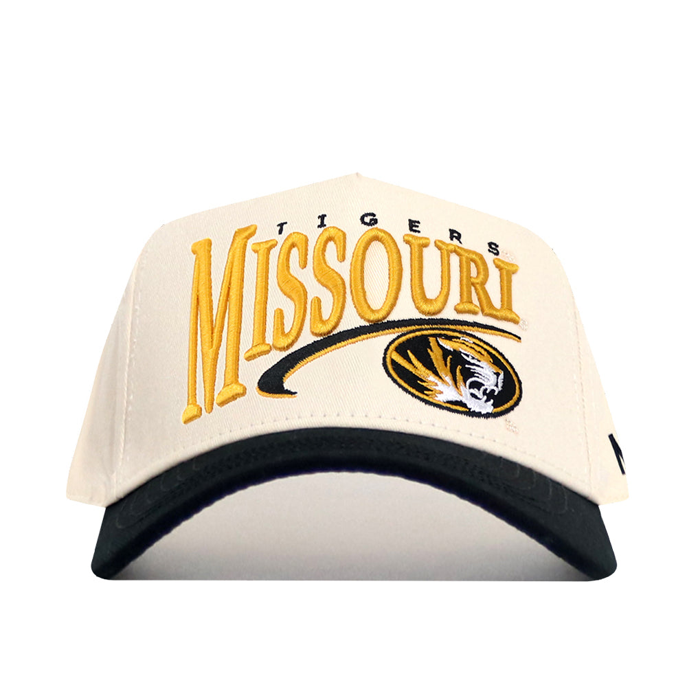 The No Rivals Missouri Tigers Stride Hat is a white and black snapback featuring the officially licensed Missouri Tigers and tiger logo embroidered in gold and black on the front.