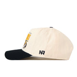 A cream No Rivals Missouri Tigers Stride Hat, featuring a black brim and side view. The letters NR are embroidered in black on the side, with part of a yellow and black embroidered logo visible on the front. This officially licensed snapback hat blends classic style with quality craftsmanship.