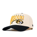 The No Rivals Missouri Tigers Stride Hat is a cream and black snapback featuring officially licensed embroidered Missouri and tiger logos on the front, proudly representing the Missouri Tigers.