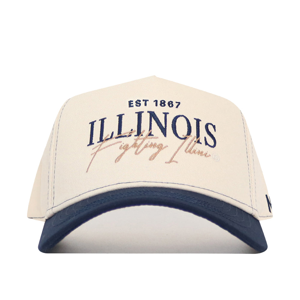 The No Rivals Illinois Fighting Illini Vintage Hat features a white cotton crown with a navy brim and showcases “EST 1867 ILLINOIS Fighting Illini” embroidered on the front in blue and tan lettering. This officially licensed snapback is perfect for any true fan.