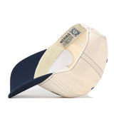 The Illinois Fighting Illini Vintage Hat by No Rivals is featured here turned inside out, highlighting its inner tags and detailed stitching. Made from high-quality cotton, this snapback cap boasts a navy brim and an interior tag reading “NO RIVALS.” Combining comfort and style, it’s perfect for any occasion.