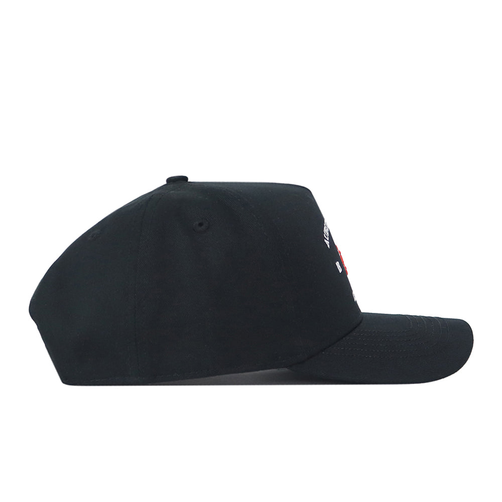 The No Rivals Auburn Outlaw Hat in black is displayed in a side view against a white background, featuring a slightly curved brim and subtle embroidered logo details partially visible near the front. This officially licensed snapback design delivers both comfort and style.