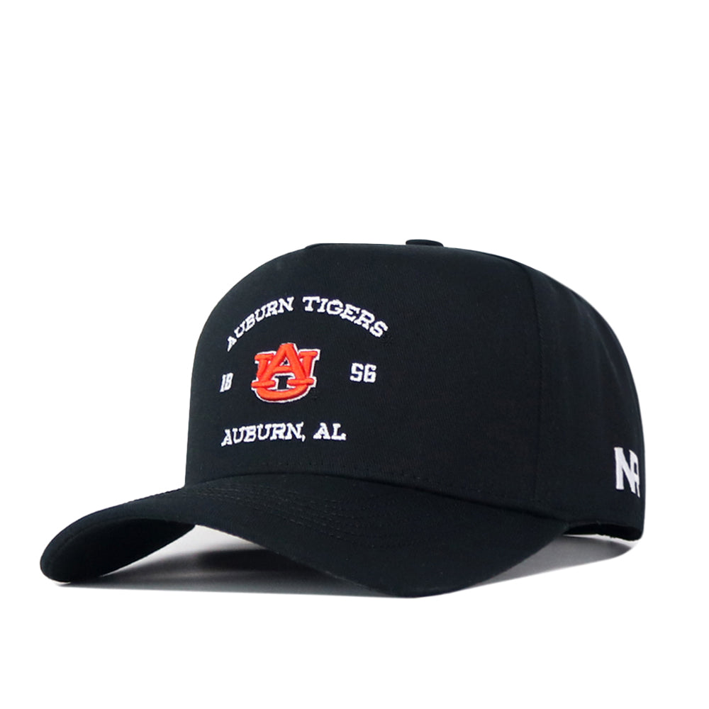 Introducing the Auburn Outlaw Hat - Black by No Rivals: This officially licensed baseball cap features the Auburn Tigers logo and “Auburn Tigers 1856 Auburn, AL” embroidered in white, an embroidered N logo on the side, and an adjustable snap back closure.