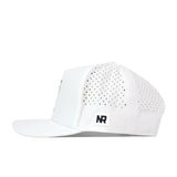 Introducing the Purdue Boilermakers Football Mascot Hat in white by No Rivals. This performance fabric hat features small ventilation holes on the sides and back, a flat brim, and a distinctive square black-and-white No Rivals patch positioned above the brim on the side. The hat offers a snap back adjustment for a comfortable fit and is shown photographed from the side.