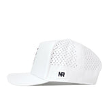 The No Rivals Texas State Golf Hat in white features a snapback closure, perforated side panels for optimal ventilation, and a sleek rectangular NR logo patch on the side. Displayed in a side profile against a plain white background, this hat showcases its contemporary embroidered detailing and modern design.