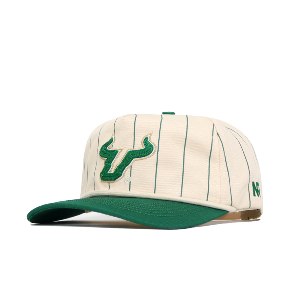 The No Rivals USF Pinstripe Hat is an officially licensed cream cap with green pinstripes, a green bull logo on the front, a green brim, a small green N logo on the side, and an adjustable snapback for comfort.