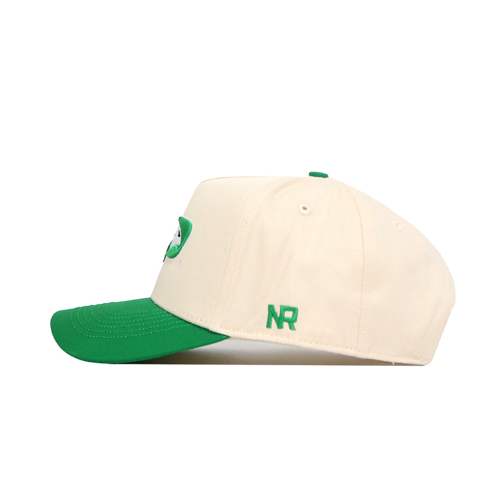 The North Dakota Logo Patch Hat by No Rivals is a cream baseball cap with a green brim, button, and side NR embroidery—offering structured fit, comfort, and style for golf or everyday wear.