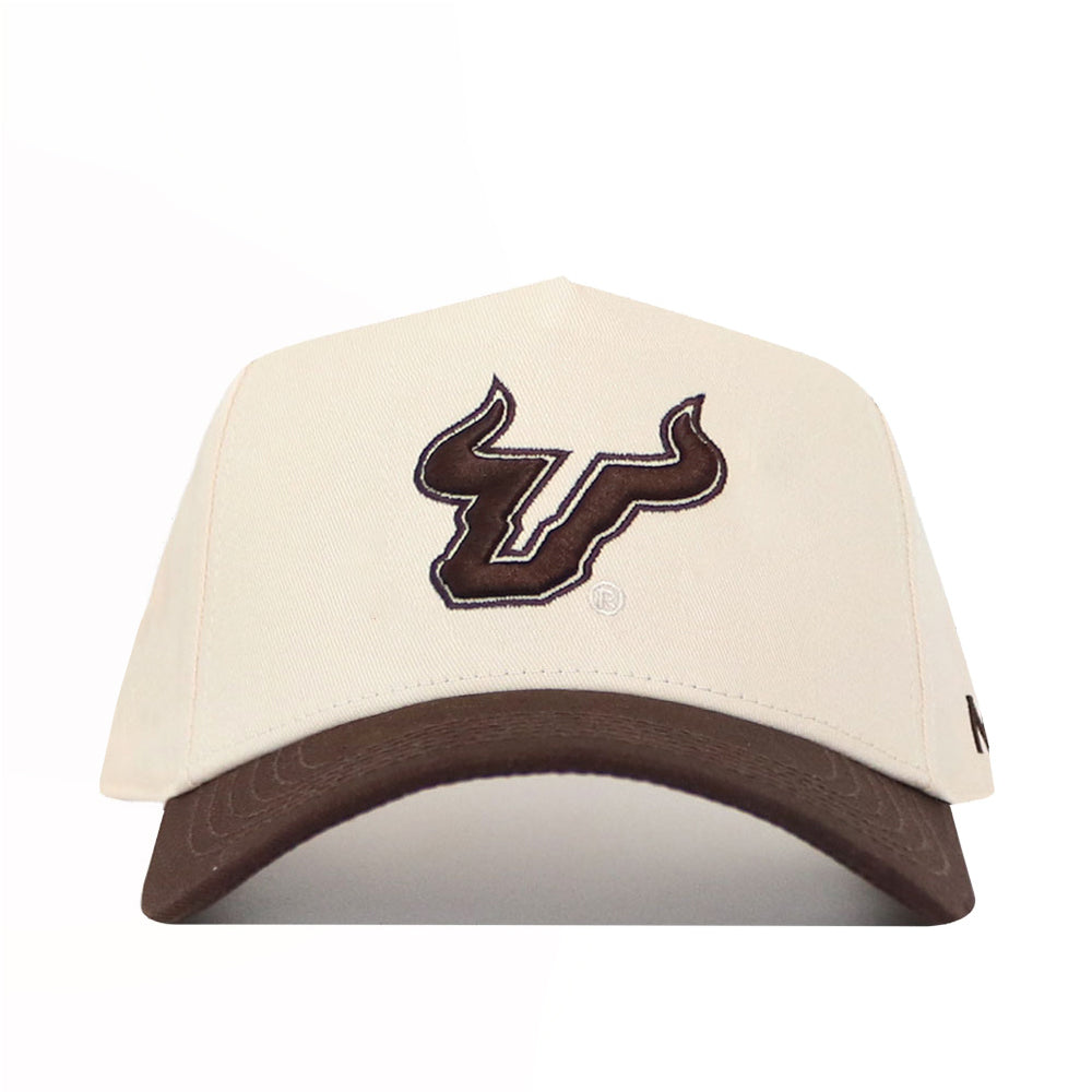 The No Rivals USF Espresso Hat is a beige cotton baseball cap with a brown bull head logo on the front and a brown brim. It features a snap back closure for adjustable fit, displayed on a white background.
