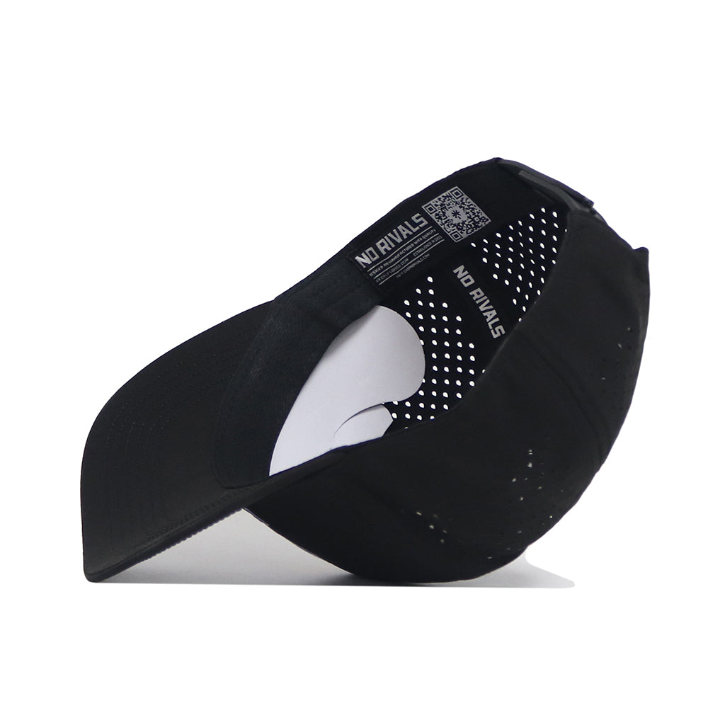 The Kansas Golf Hat - Black by No Rivals features a curved visor, perforated inner lining, and "NO RIVALS" printed on the inner band next to a QR code. The snapback closure offers adjustable fit. Shown from underside in black.