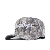 A Vandy Boys Outland Hat by No Rivals, camouflage snapback style, with "CountryBoys" embroidered in white script on the front and the brim angled to the left.