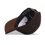 The EWU Americano Hat by No Rivals is a brown snapback featuring a curved brim, a black headband with "NO RIVALS" in white, and visible inner lining. Made from high-quality cotton for comfort and structure.