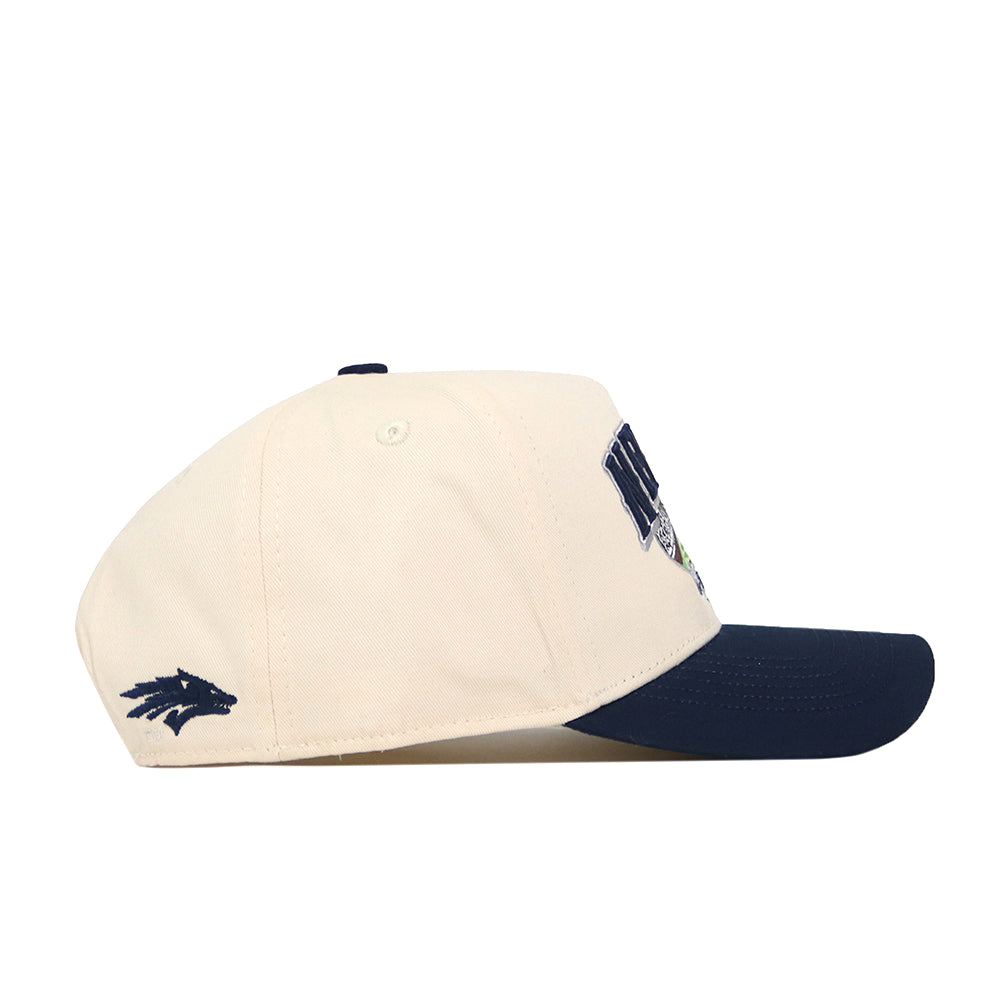 Introducing the Nevada Wolf Pack Stadium Hat by No Rivals—a cream-colored snapback with a navy brim and coordinated stitching. This officially licensed cap features a dark blue wolf head embroidered on the side and partial lettering on the front, blending classic style with premium details.