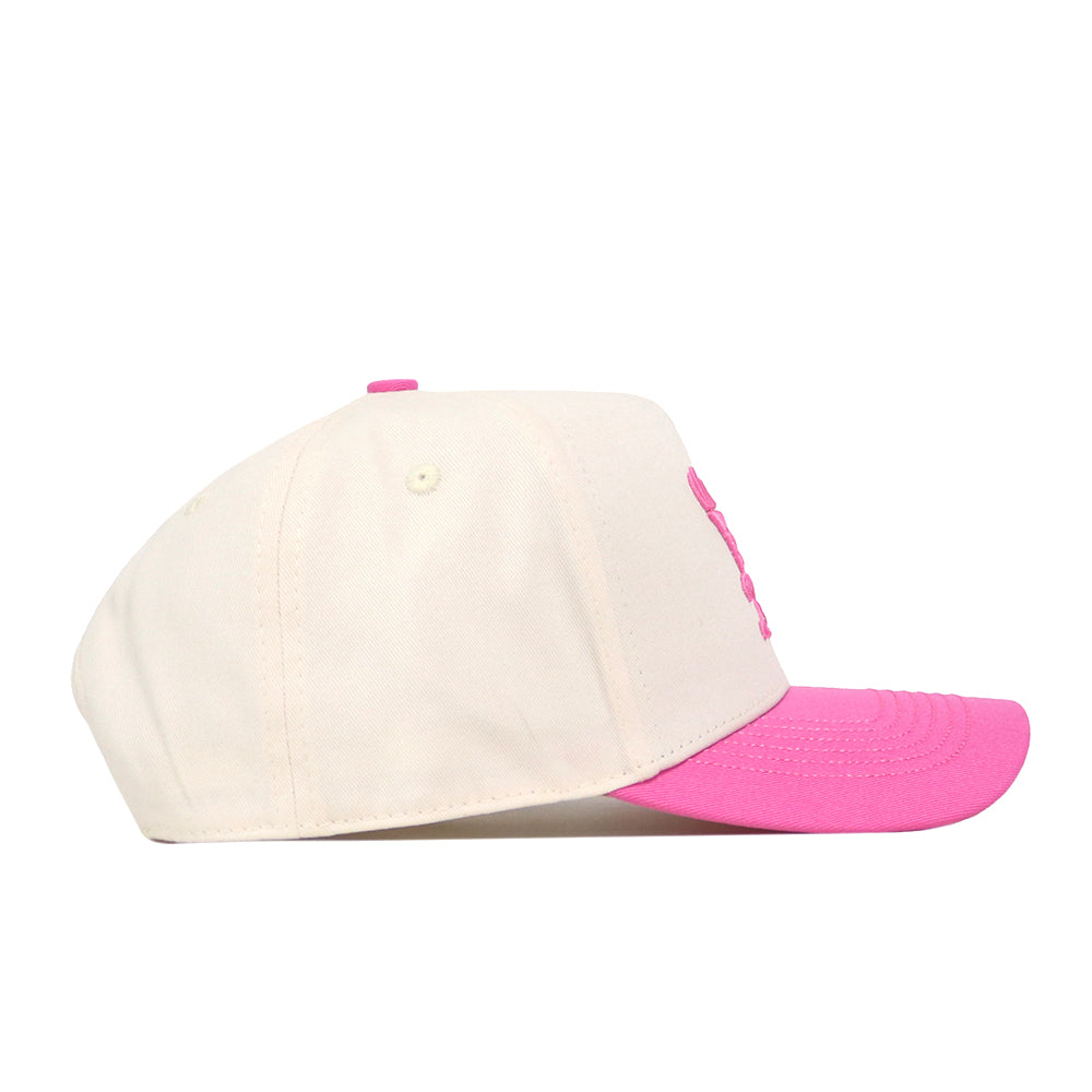 The No Rivals EWU Pink Out Hat is a beige baseball cap with a vivid pink brim and a coordinating pink button on top, featuring a Snap Back Adjustment for a customizable fit, displayed from the side against a white background.