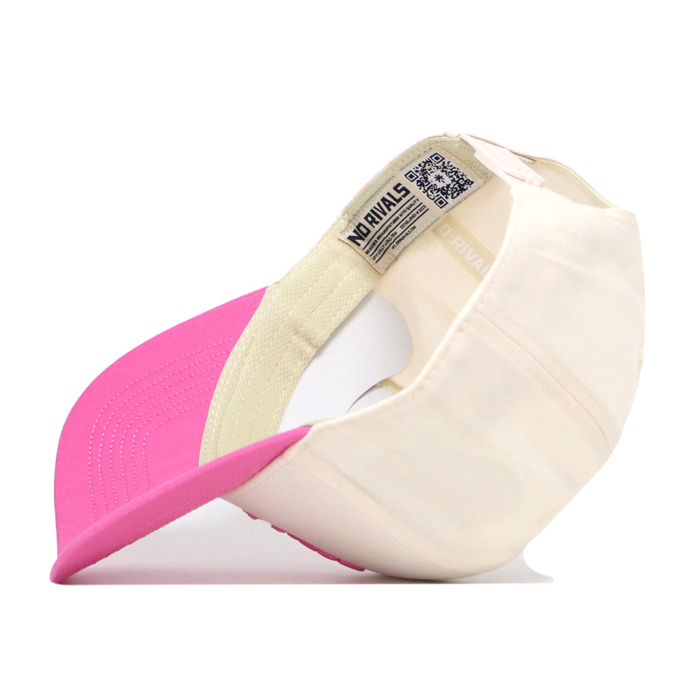 The EWU Pink Out Hat by No Rivals is shown inside out, revealing a label with the No Rivals text and a visible QR code on the inner band. This cream and pink baseball cap features a snapback adjustment for a comfortable fit.