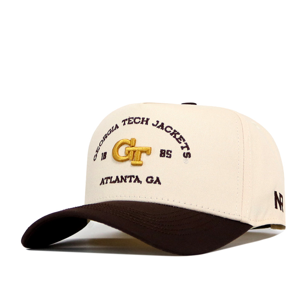 The No Rivals Georgia Tech Yellow Jackets Outlaw Hat - Classic features a beige and black snapback design with “Georgia Tech Jackets 1885 Atlanta, GA” and a gold GT embroidered logo on the front—officially licensed for true fans.