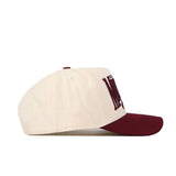The Minnesota Golden Gopher Stride Hat by No Rivals is a cream-colored snapback featuring a maroon brim and partially maroon embroidered logos on the front, displayed from the side against a white background.