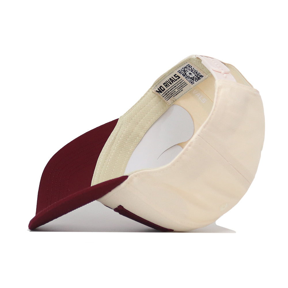 The Minnesota Golden Gopher Stride Hat by No Rivals is shown upside down, revealing its inner label, QR code, and the NO RIVALS branding on the inside band.