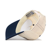 A side view of the No Rivals Ole Miss Rebels Vintage Hat in navy showcases its inner lining, detailed stitching, and officially licensed labels inside—making it a perfect finishing touch for your gameday outfit.
