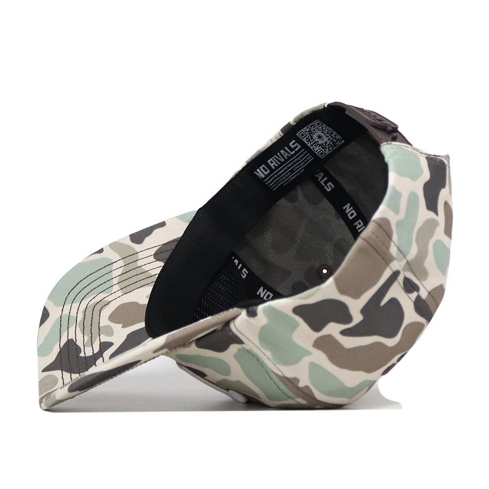 The Pittsburgh Panthers Huntsman Hat by No Rivals is a camouflage snapback crafted from high-quality cotton for lasting comfort and style. Flipped upside down, the inside label reveals the NO RIVALS branding, while the structured fit and blend of green, brown, and beige shades give this baseball cap its signature look.