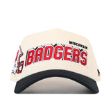 Introducing the No Rivals Wisconsin Alma Mater Hat—a white and black snapback featuring “WISCONSIN BADGERS” in bold red and black lettering, accented with an embroidered football helmet graphic on the left side. Crafted from high-quality cotton, this hat showcases premium embroidered logos for an upscale look and feel.