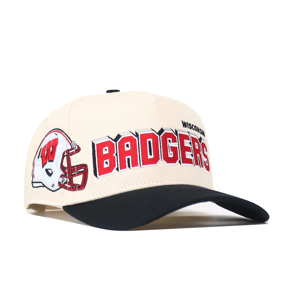 The Wisconsin Alma Mater Hat by No Rivals is a beige and black snapback made from high-quality cotton. It showcases a red football helmet and “BADGERS” in bold red lettering, with “WISCONSIN” embroidered above. Embroidered logos on the front and side complete its standout style.