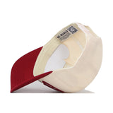 The South Carolina Gamecocks Stride Hat by No Rivals is shown upside down to display the inside label, neat stitching, and a QR code beneath the brim. Made from high-quality cotton for lasting comfort, this snapback cap maintains its classic shape with a structured fit.