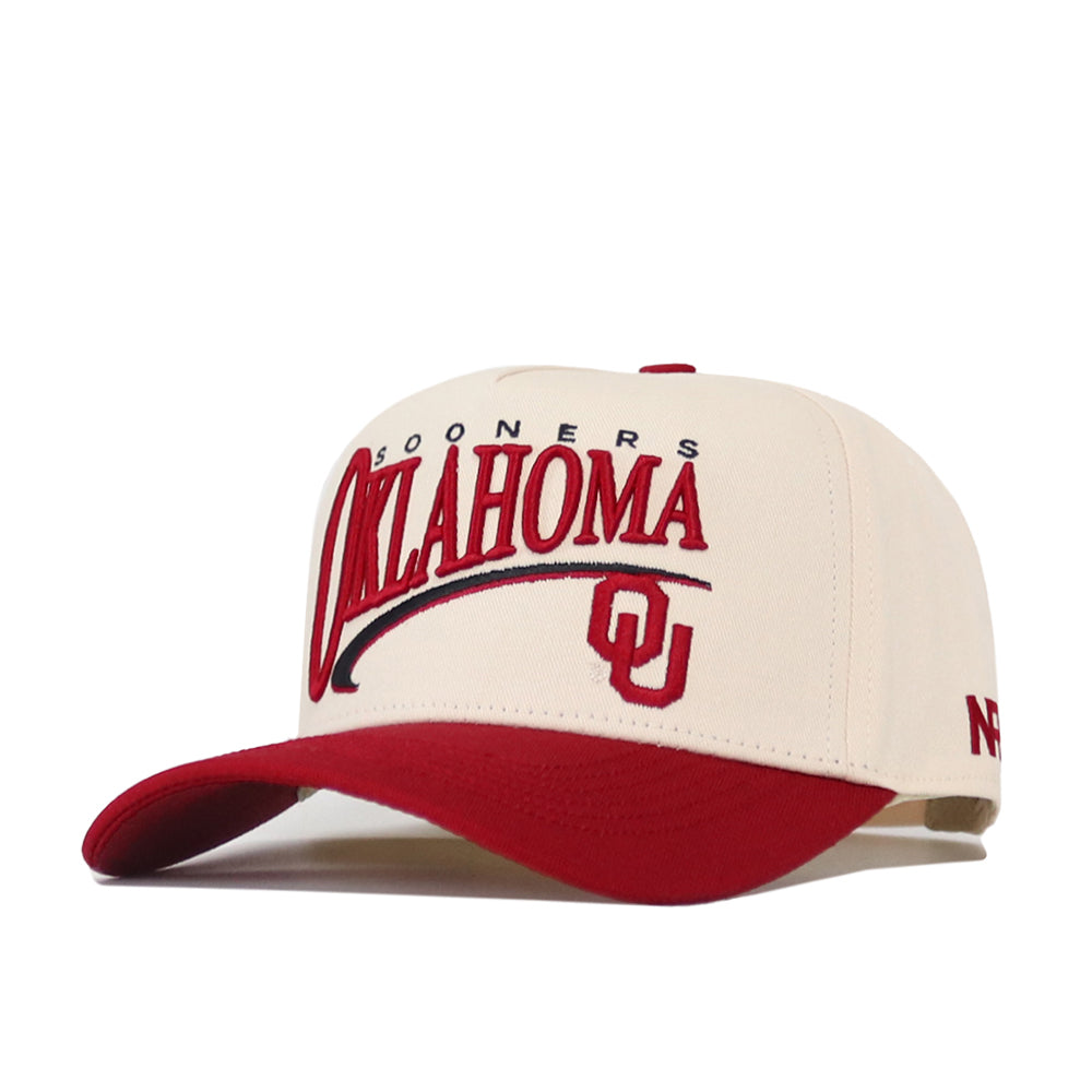 The No Rivals Oklahoma Sooners Stride Hat features a cream-colored crown and red bill, with the Oklahoma Sooners and OU logo embroidered on the front. Made from soft cotton, this structured snapback cap combines comfort with team spirit.